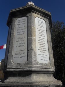 An octagonal monument with inscriptions in Maltese and Arabic (pictured) and six other languages describing the biblical story of St. Paul in Malta